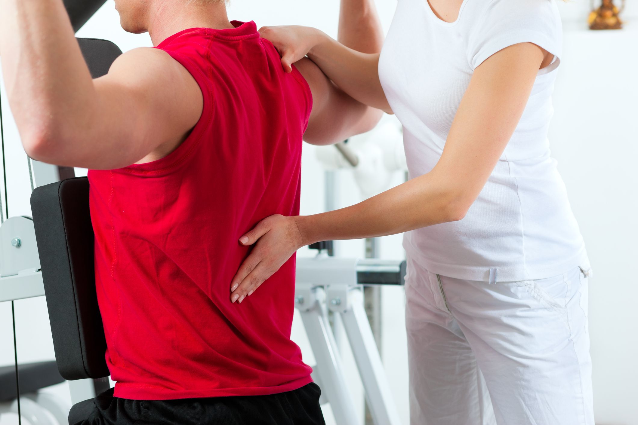 Man and woman at personal training session during a back workout