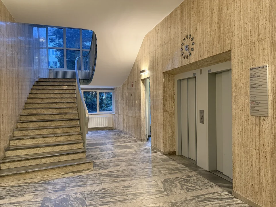 Stairwell with a lift for step-free access to Rose Physio